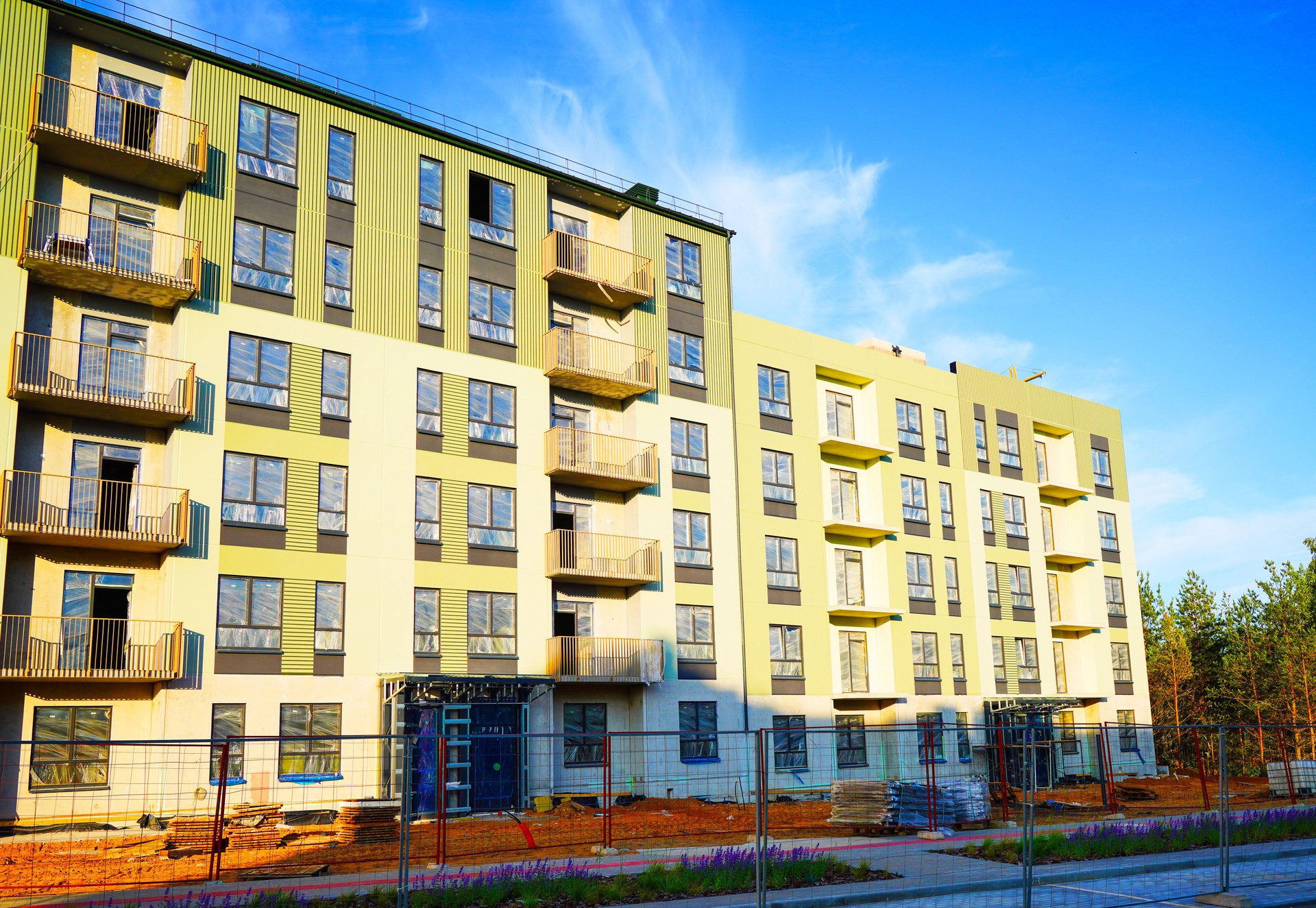 Residential condominium building construction. New Modern complex of Apartment residential condo construction.